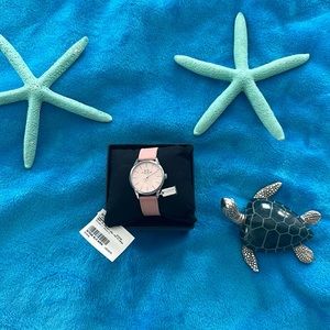 Brand new with tags Coach watch in box never worn in pink.